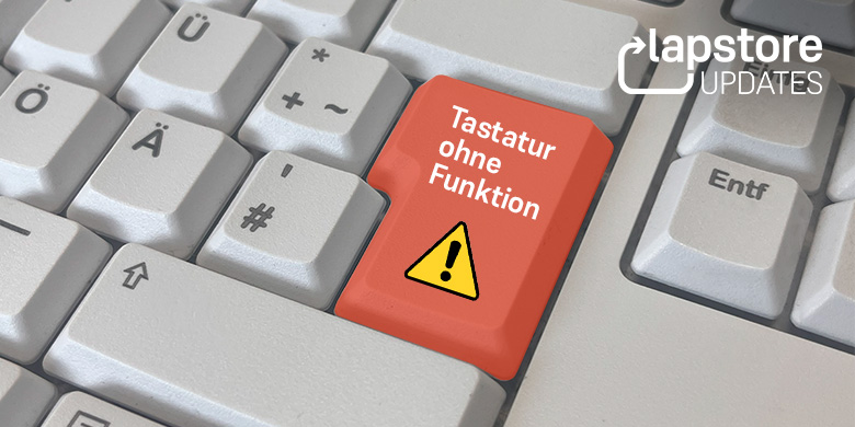Tastatur mit roter Entertaste und Warnsymbol